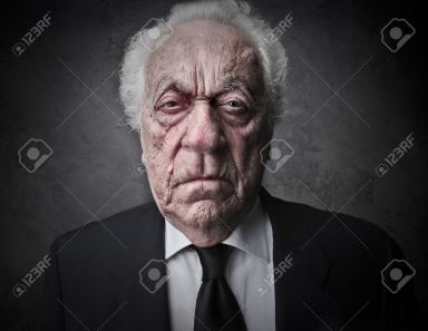 19501715-old-man-with-a-serious-expression-Stock-Photo-business
